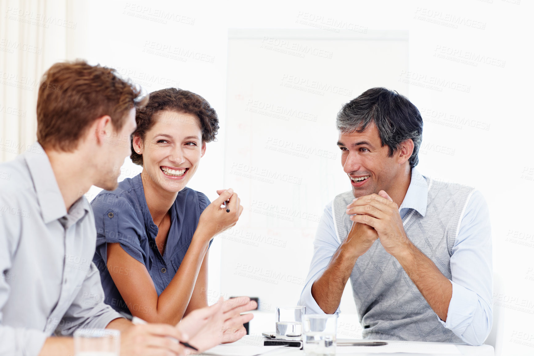 Buy stock photo Employees, people and happy at office in meeting for teamwork, collaboration and discussion for project. Business, boardroom and conversation with feedback, report and update on strategy and planning