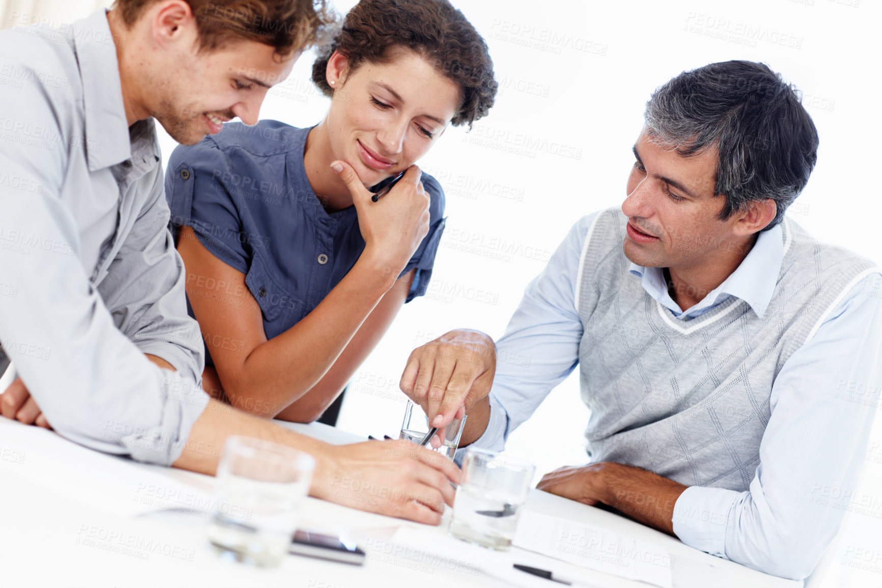 Buy stock photo Business people, pointing and meeting with schedule for contract, policy or planning tasks at office. Group of employees in team discussion on documents for benefits, deal or development at workplace