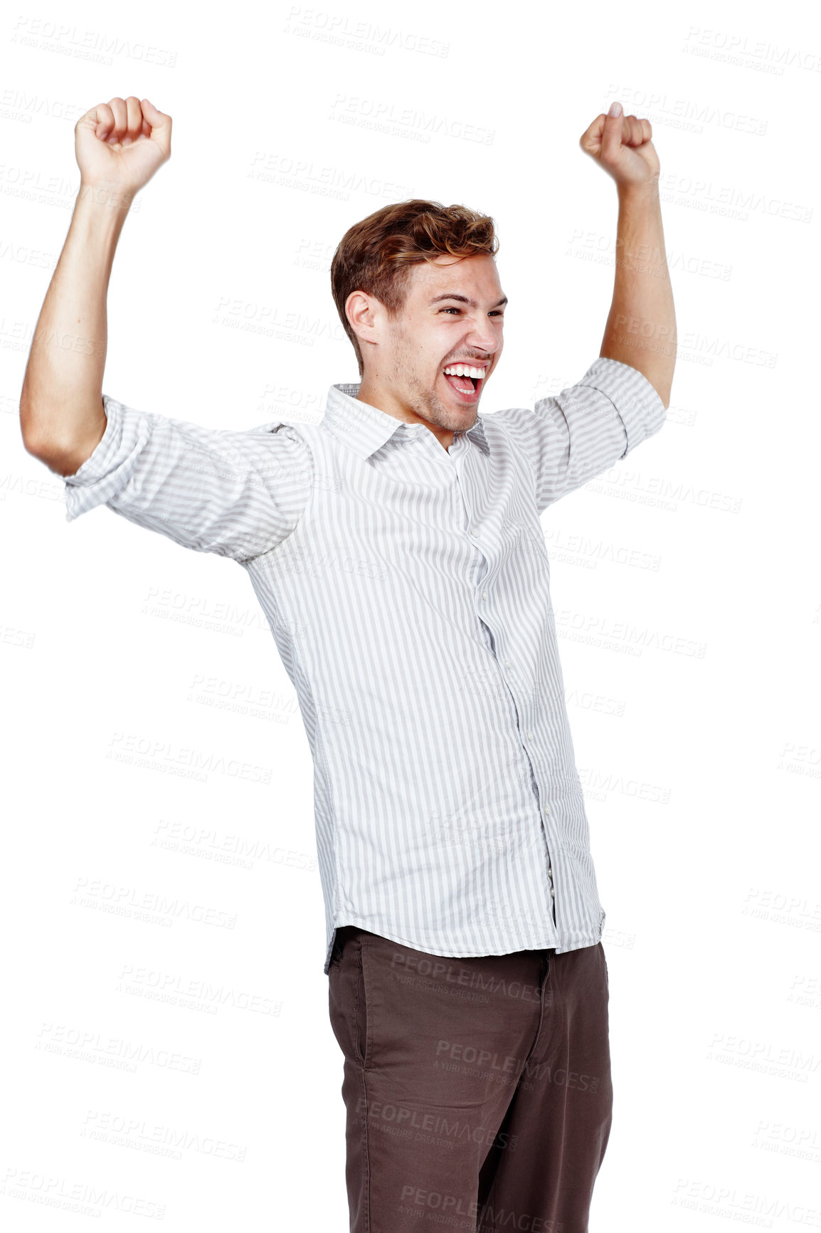 Buy stock photo Handsome young man posing against a white background in studio. Excited male wearing a stripped shirt posing with his arms raised, celebrating and cheering a win or achievement. Success and victory