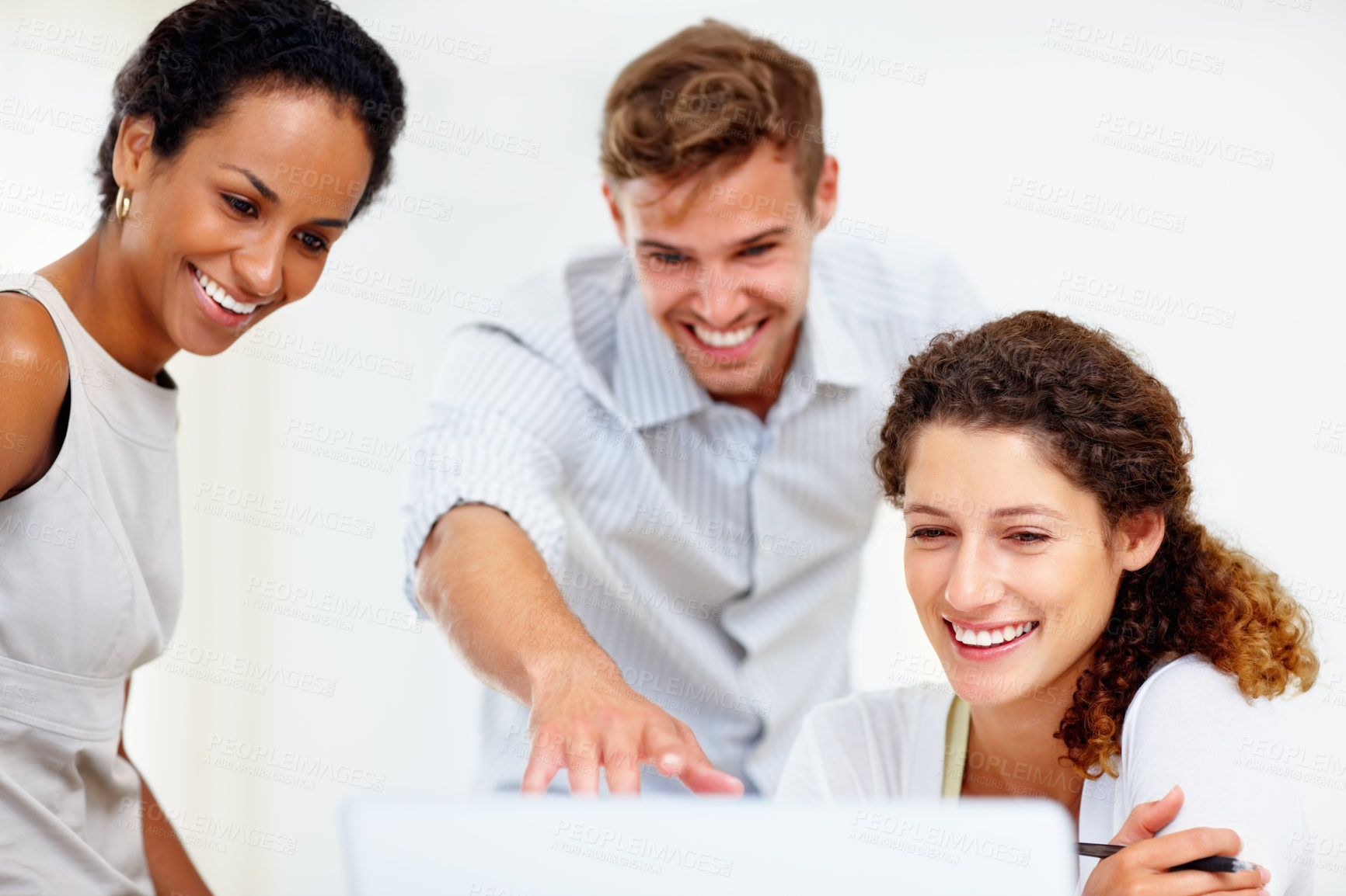 Buy stock photo Laptop, pointing and smile with business people in office together for programming or web development. Collaboration, computer and meeting with developer team in creative workplace for planning