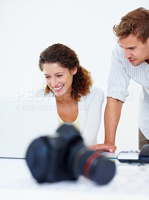 Buy stock photo Business people working on laptop with camera in foreground