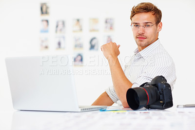 Buy stock photo Relax, man and photographer with portrait in office, camera and laptop with catalog for research trend topics. Male visual artist, creative agency and online for project management and editing photos