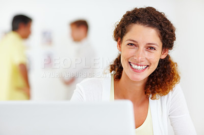 Buy stock photo Closeup portrait of attractive business woman using laptop with colleagues in blurred background