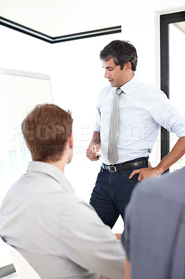 Buy stock photo Shot of a group of business people having a financial meeting in a boardroom