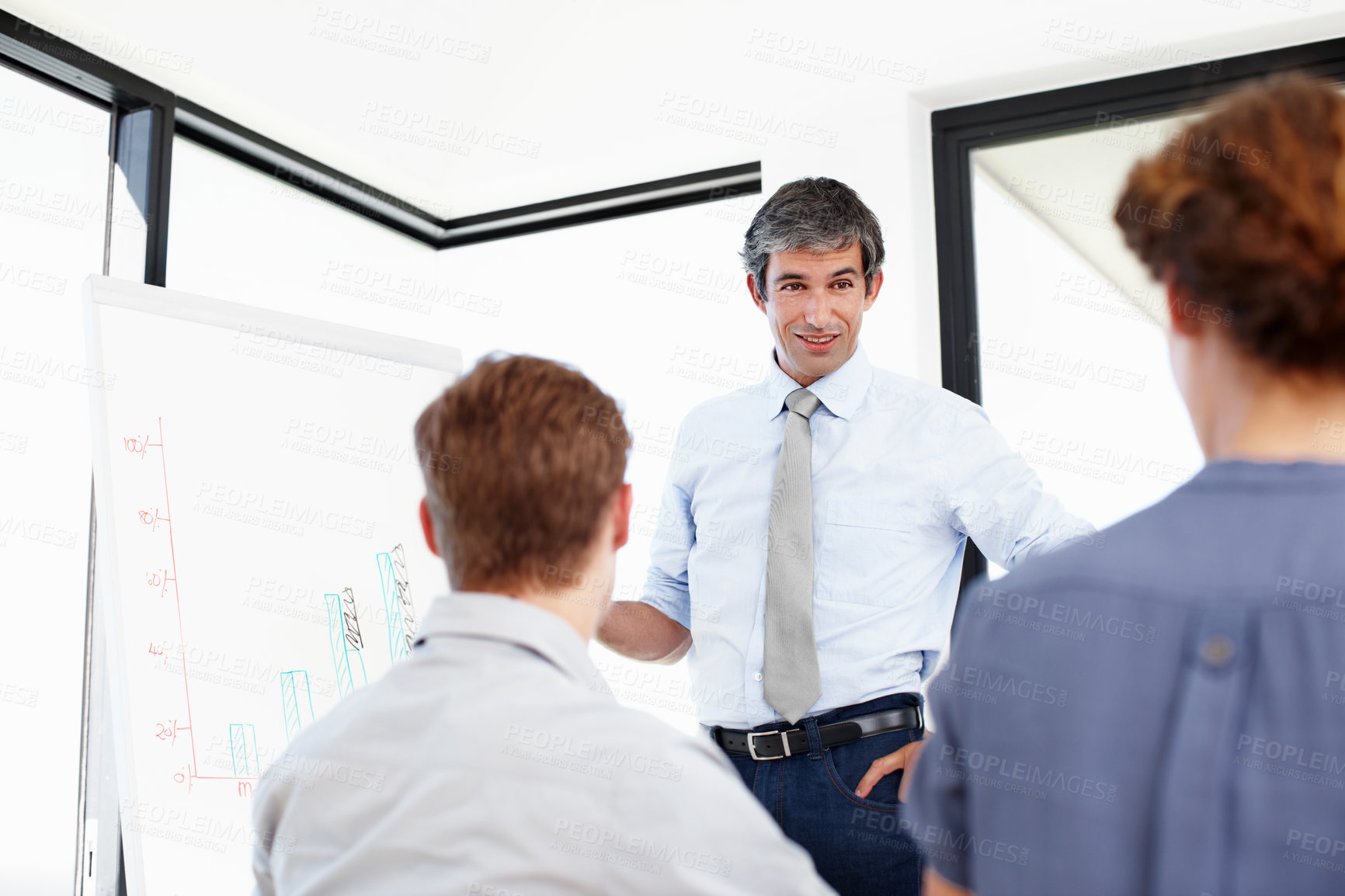 Buy stock photo Shot of a group of business people having a financial meeting in a boardroom