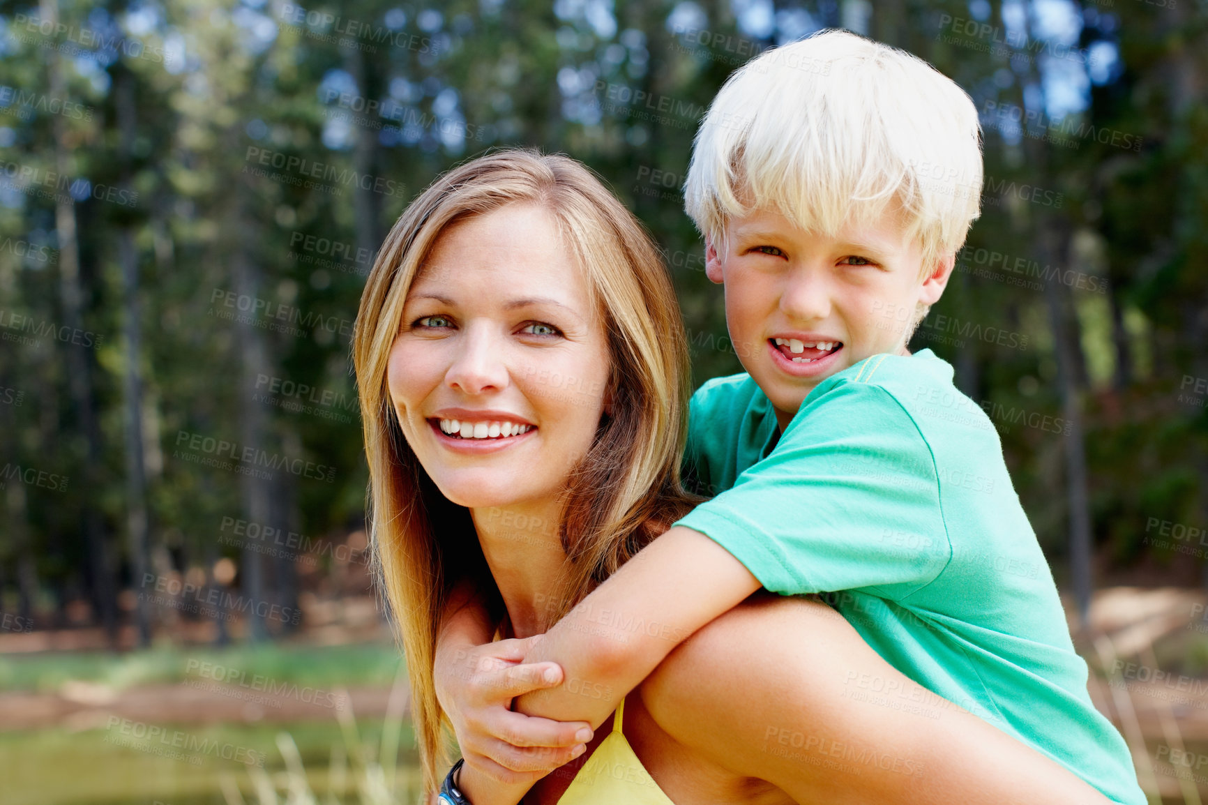 Buy stock photo Portrait, piggy back and mother with son, nature and travel with adventure, getaway trip and bonding together. Face, family and single parent with boy, trees and embrace with childhood and outdoor
