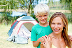 Woman camping with son