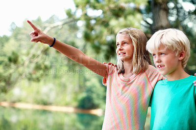 Buy stock photo Camping, boy and girl pointing in outdoor for bird watching, adventure and vacation in forest for weekend trip. Children, woods and showing with mother nature, hug and wilderness for explore