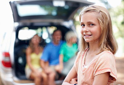 Buy stock photo Portrait, vacation and happy kid outdoor for road trip with father, mother and sibling in suv car. Face, family and confident girl in forest for holiday, adventure or travel with parents in transport