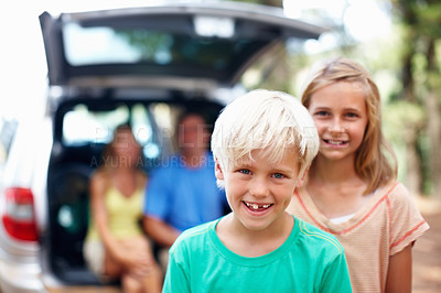 Buy stock photo Smile, boy and girl with portrait for camping outdoor with family for adventure and weekend trip in mother nature. Happy children, siblings and cute in forest on summer holiday in wilderness.