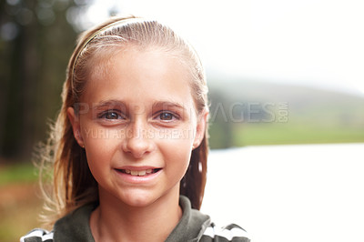 Buy stock photo Smile, child and portrait with nature mockup for relax, adventure and lesson in scouts programme. Young girl, face and outdoor at lake for summer vacation, holiday or trip for growth and development