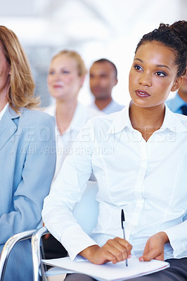 Buy stock photo Portrait of African American female executive noting down in seminar