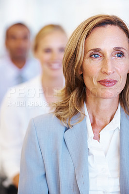 Buy stock photo Portrait of mature business woman smiling while attending seminar