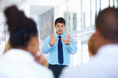 Buy stock photo Portrait of male speaker giving presentation to his colleagues