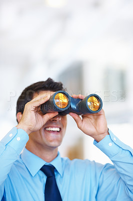 Buy stock photo Portrait of attractive young business man using binoculars