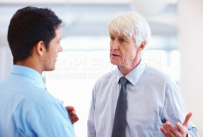 Buy stock photo Portrait of successful business men having serious conversation at office
