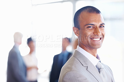 Buy stock photo Closeup of African American business man smiling with associates in background