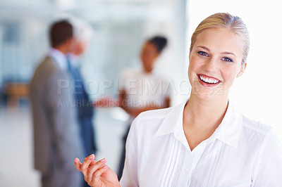 Buy stock photo Portrait of young Caucasian business woman with executives in background