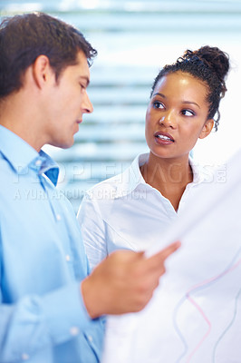 Buy stock photo Portrait of attractive multi ethnic architects discussing while looking at blueprint