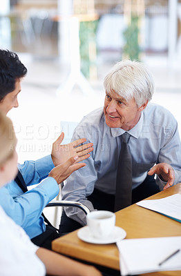 Buy stock photo Portrait of male executives having happy conversation with female executive at office