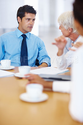 Buy stock photo Portrait of young business man discussing with senior executive in meeting