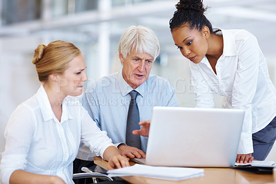 Buy stock photo Portrait of multi ethnic associates working on laptop together at office