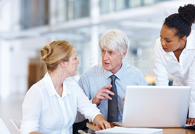 Buy stock photo Portrait of multi racial business people discussing while using laptop at office