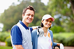 Golfing couple with an attractive smile
