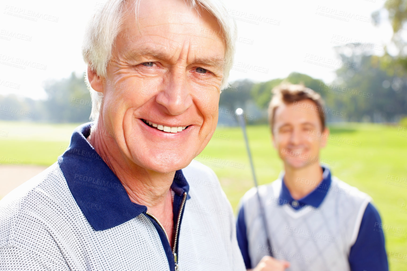 Buy stock photo Closeup of senior man smiling with son holding a golf club in background