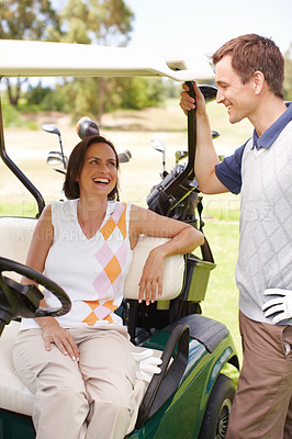 Buy stock photo Laugh, club and couple in golf cart for game, outdoor bonding and fitness on weekend morning together. Love, happy woman and man in buggy for sports transport, health and wellness with fun exercise.