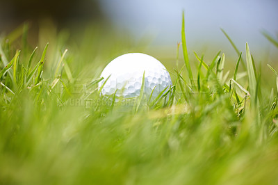 Buy stock photo Shot of a golf ball out on the course 