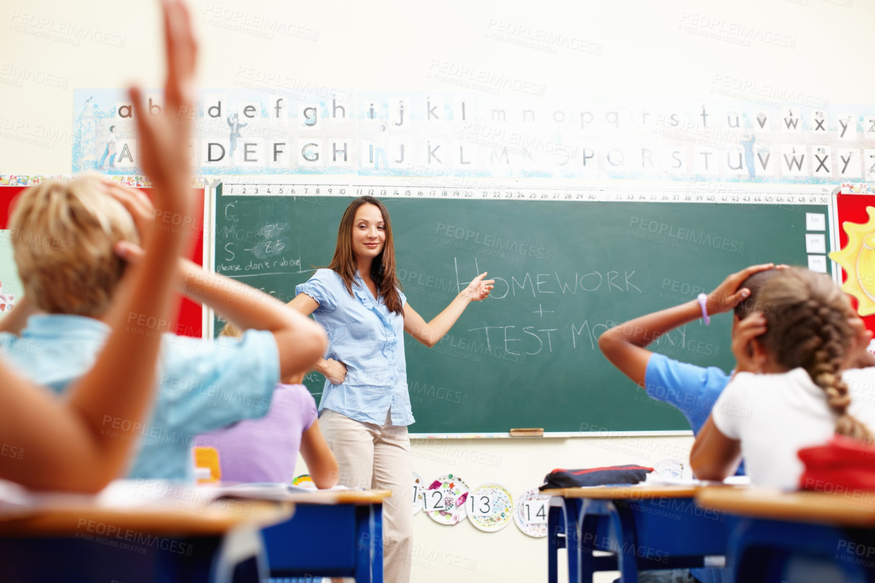 Buy stock photo Chalkboard, teaching and woman in kids classroom for learning, growth and child development. Lesson, education and teacher with shocked students, surprise test or homework at elementary school