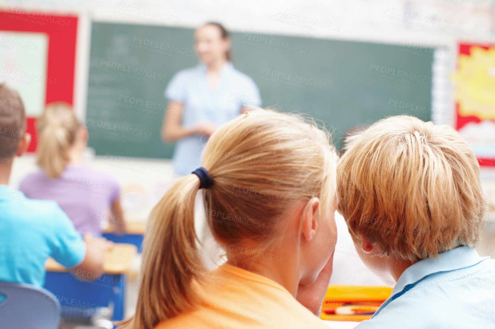 Buy stock photo Whisper, students and kids in classroom, back and conversation with education, knowledge and talking. Friends, boy and girl in school, gossip and disturb with plan for recess, discussion and children