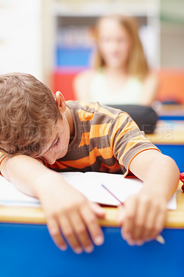 Buy stock photo Sleeping, boy and student in classroom, tired and fatigue with homework, notebook and stress. Child, school and kid with burnout, exam and exhausted with test, overworked and relax with development