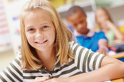 Buy stock photo Smile, portrait and girl in classroom for learning, growth and child development at elementary school. Happy, face and student at desk for education, study and future opportunity for scholarship.