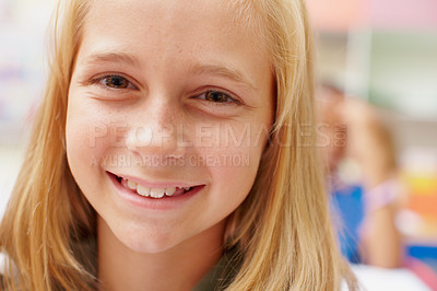 Buy stock photo Smile, portrait and girl in class for learning, growth and child development at elementary school. Happy, face and student at desk for kids education, study and future opportunity for scholarship.