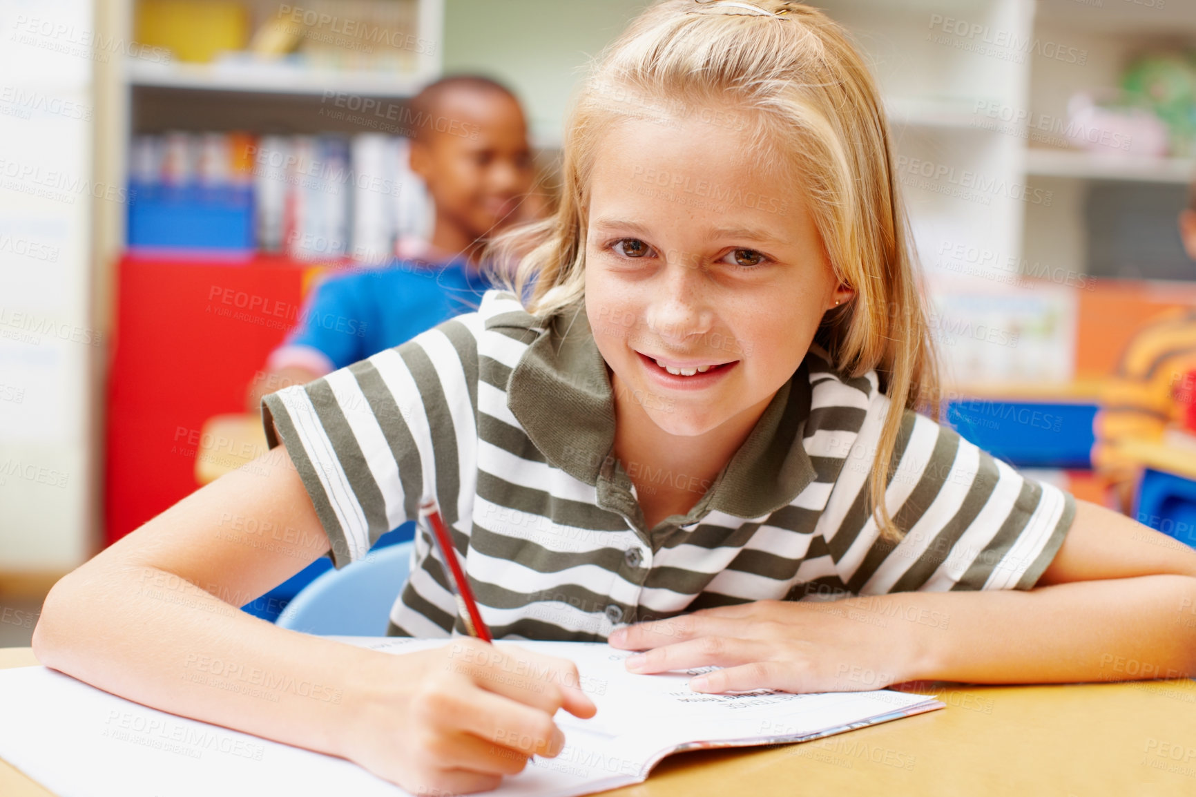 Buy stock photo Writing, school and portrait of child in classroom for learning, education and lesson for development. Student, academy and young girl with books for practice, creativity and assignment for knowledge