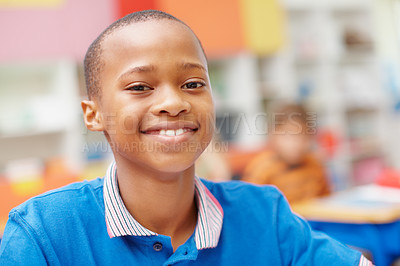 Buy stock photo Smile, portrait and boy in class for education, growth and child development at elementary school. Happy, face and student at desk for kids education, studying and future opportunity for scholarship.