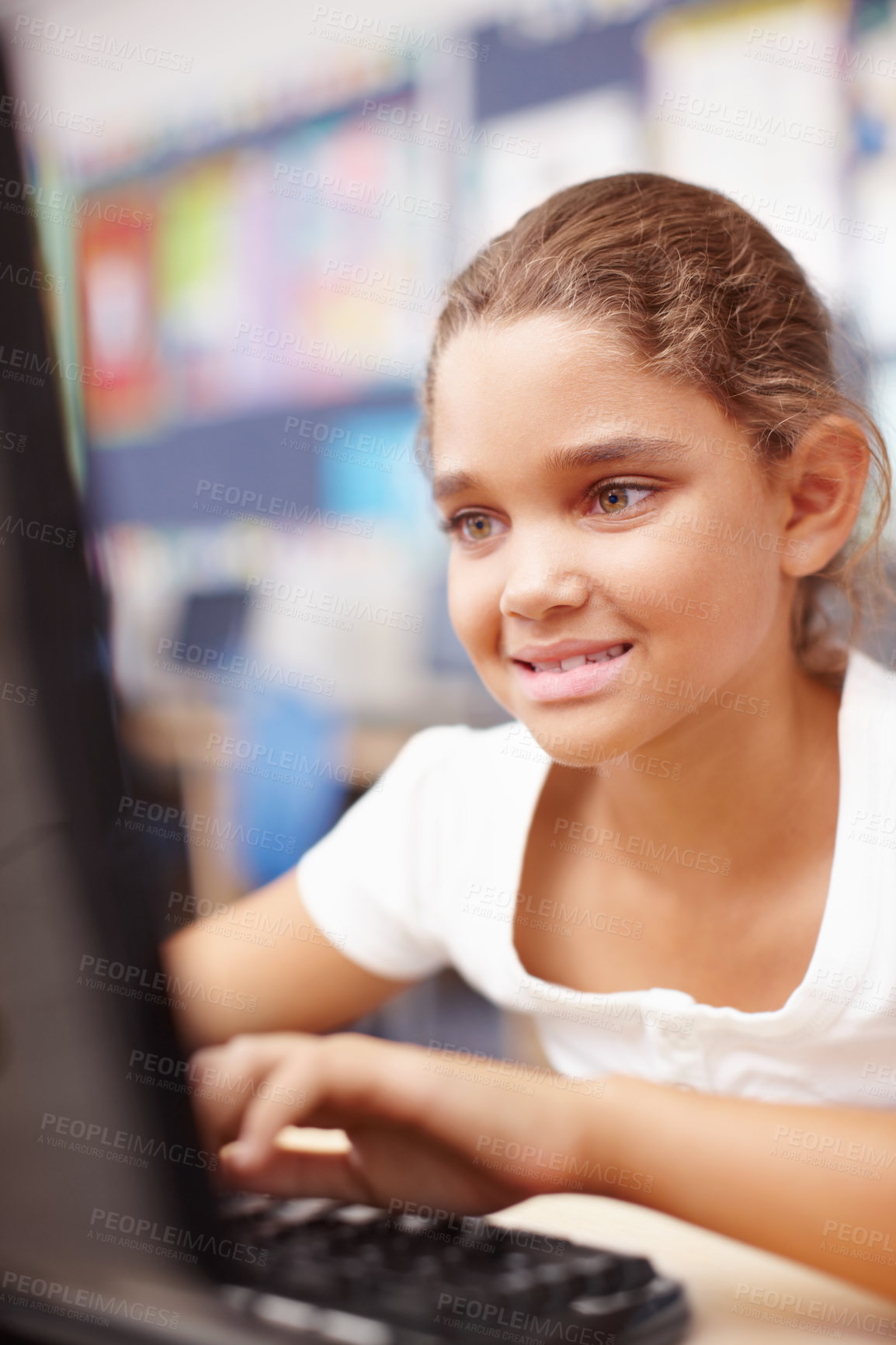 Buy stock photo Education, girl and student in classroom, computer and typing with research, online learning and study. Person, childhood or kid in school, pc or internet for development, intelligent or website info