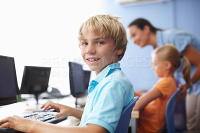 Buy stock photo Portrait of a cute schoolboy in computer class