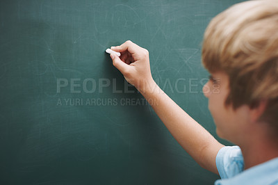 Buy stock photo Student, boy and writing on chalkboard in classroom with problem solving, education or learning development. Scholarship, child and answer question with mockup space, studying or assessment at school