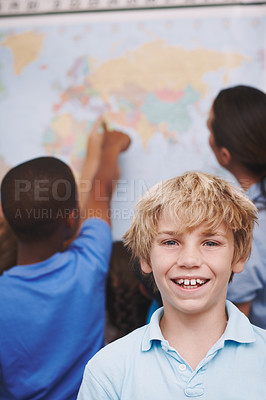 Buy stock photo Map, education and portrait of child in classroom for direction, search and future. Learning, distance and knowledge with students in school for  geography, climate zone and conservation awareness