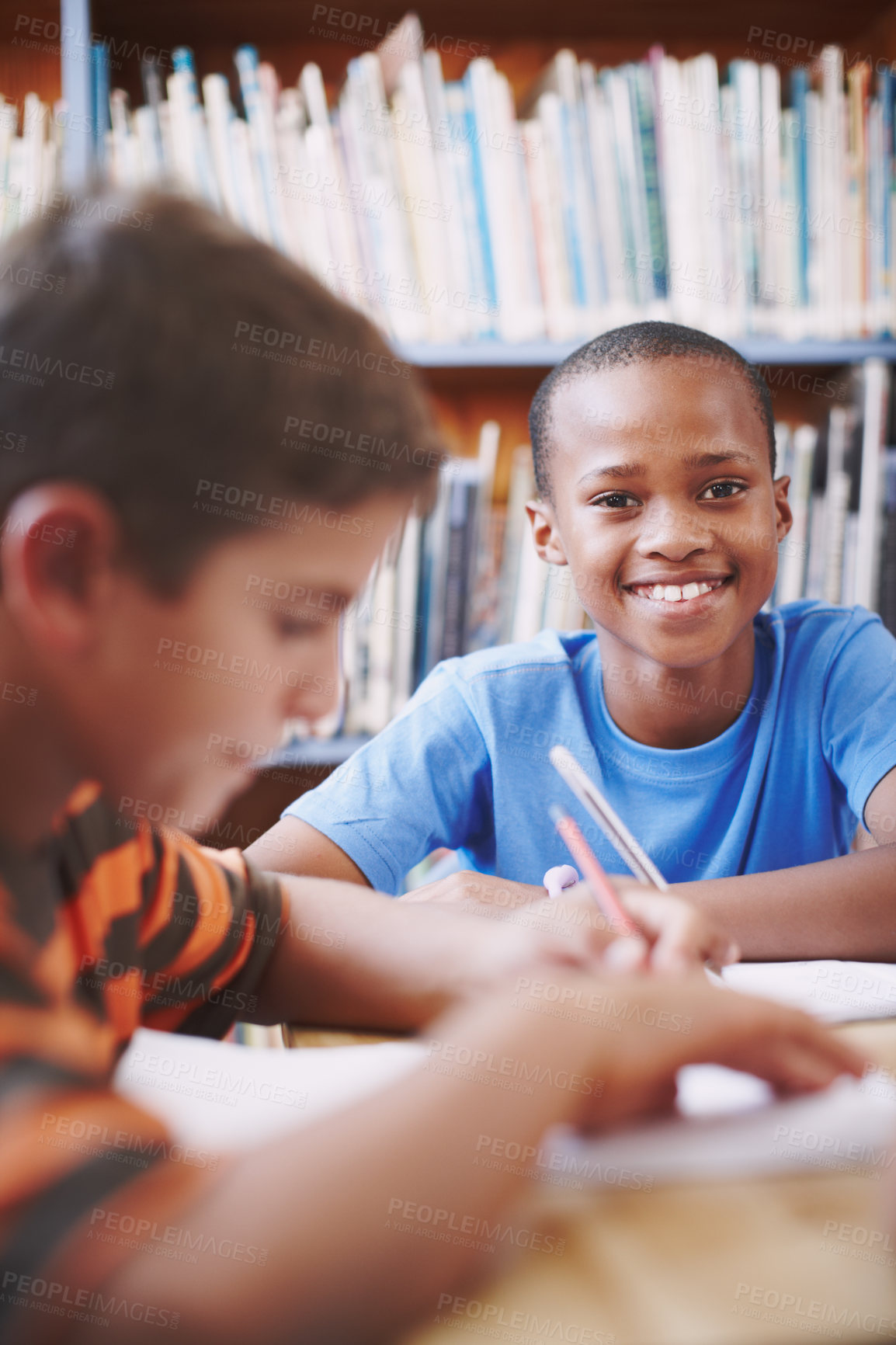 Buy stock photo Smile, black child and education with books in library for assessment research, learning notes and studying. Boy, student and writing with school test, language development and reading story for exam