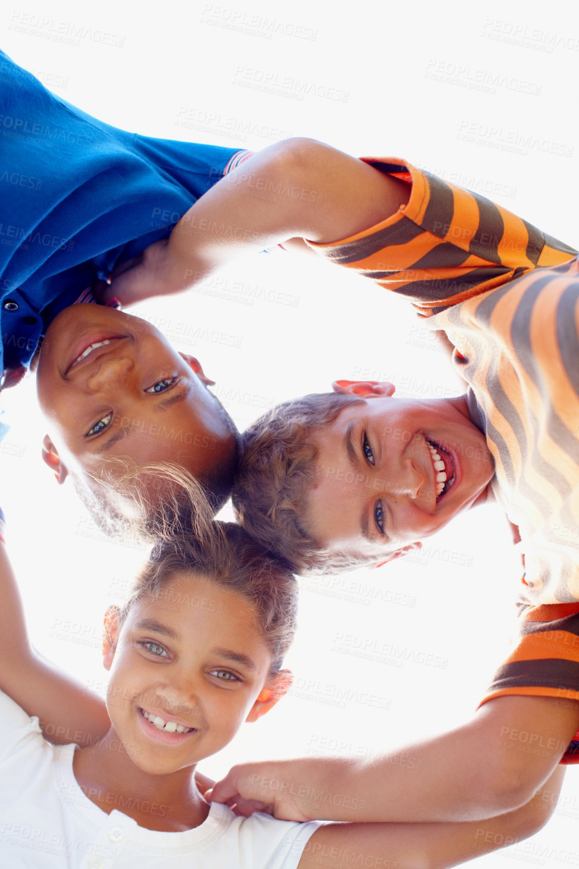 Buy stock photo Education huddle and portrait of student friends outdoor at school together for child development. Diversity, sky or smile with boy and girl kids in circle for bonding, learning or study from below