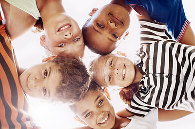 Buy stock photo Education, huddle and portrait of children friends outdoor at school together for development. Diversity, scholarship or smile with boy and girl students in circle for bonding, learning or study