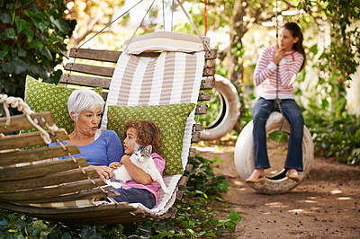Buy stock photo Grandmother, cat and children in a backyard, relax and bonding together with weekend break and happiness. Family, granny and grandkids with pet and playing with nature and outdoor for fresh air 