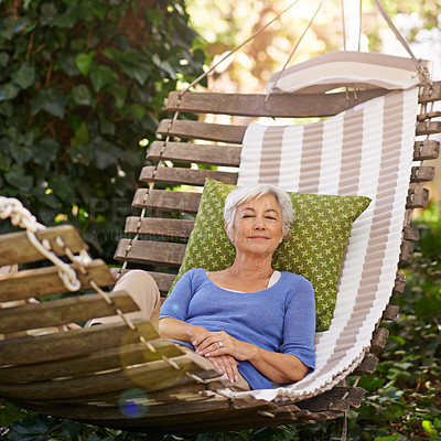 Buy stock photo Elderly, woman and sleep on hammock during retirement and relax on summer vacation with happiness. Garden, senior person nap and rest with smile during spring while happy and at peace in nature