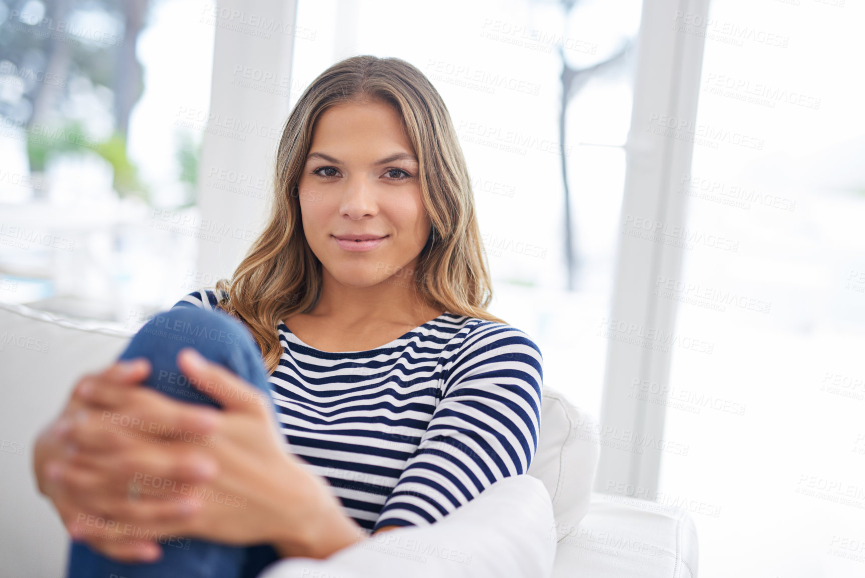 Buy stock photo Portrait, home and woman on sofa, relax and happiness with weekend break, resting and peaceful. Face, apartment and cheerful person on couch, girl and joyful with wellness, comfort or calm in lounge