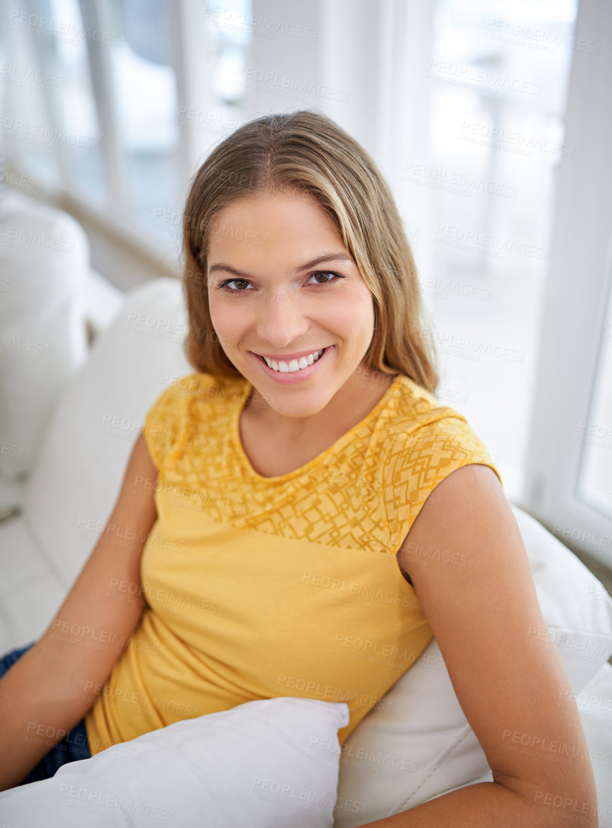 Buy stock photo Casual, portrait or happy woman in house on sofa to relax in home in living room for comfort or satisfaction. Chill, peace or confident female person in apartment for rest, break or wellness in Spain