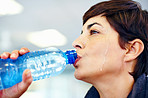 Woman hydrating after exercise